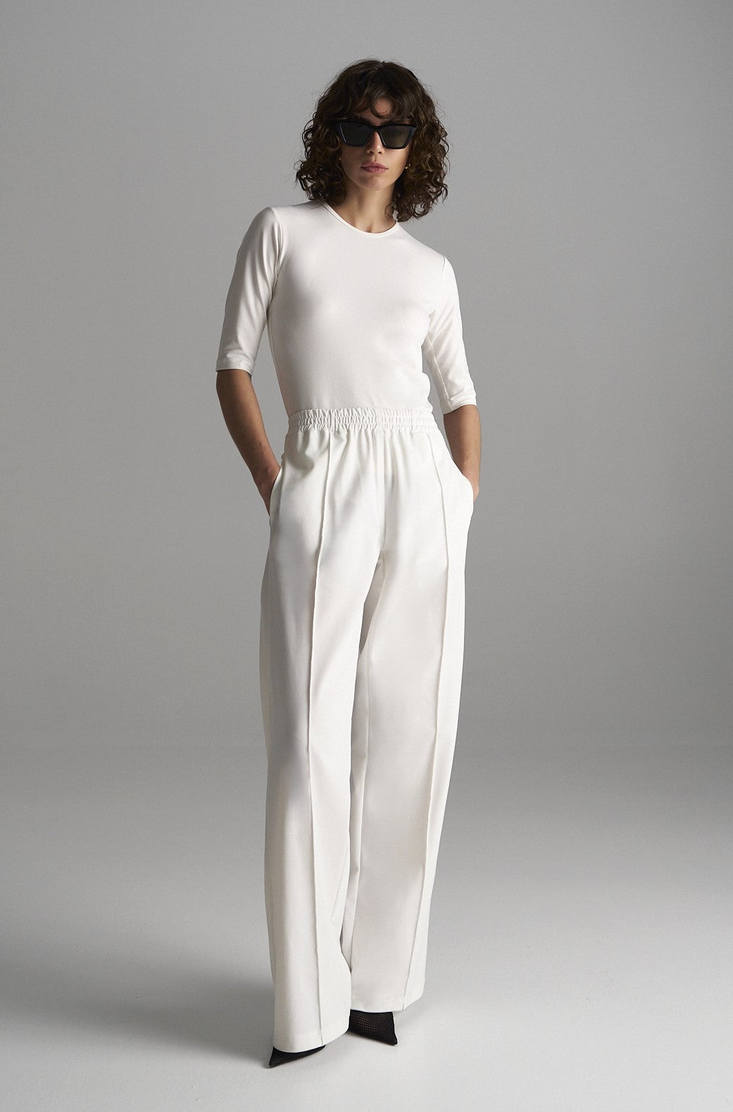Mela Purdie Flight Pants in white, crease-resistant travel-ready trousers